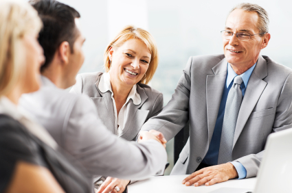 Happy mature businessman shaking hands with his mid adult colleague. Their women colleagues are beside them.  [url=http://www.istockphoto.com/search/lightbox/9786622][img]http://dl.dropbox.com/u/40117171/business.jpg[/img][/url] [url=http://www.istockphoto.com/search/lightbox/9786738][img]http://dl.dropbox.com/u/40117171/group.jpg[/img][/url]